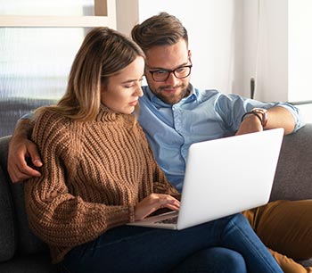 about-bioidentical-hormone-doctors-locator happy couple researching bioidentical hormone replacement therapy online together